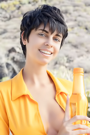 Kensi Dressed In A Bold Orange Crop Top That Hugs Her Perfect Breasts And A Matching Mini Skirt