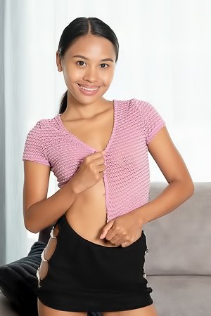 Namy Asian Poses In A Skimpy Outfit That Skims Over Her Slender Figure