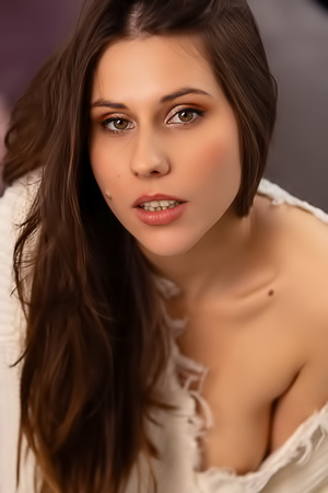 Amber Slassh Teases With Perky Nipples And Spread Legs On The Couch