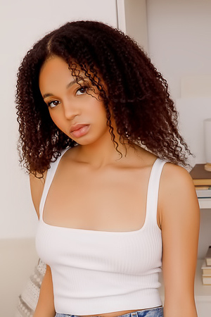 Lily Lilac Poses Topless In Denim Shorts, Baring Her Curves With Confident Ease In A Sunlit Bedroom