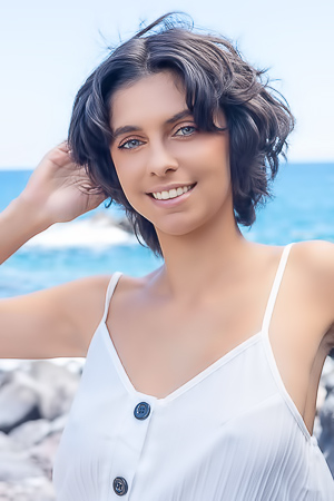 Kensi Disrobes On Deck Chair Beside Ocean Waves